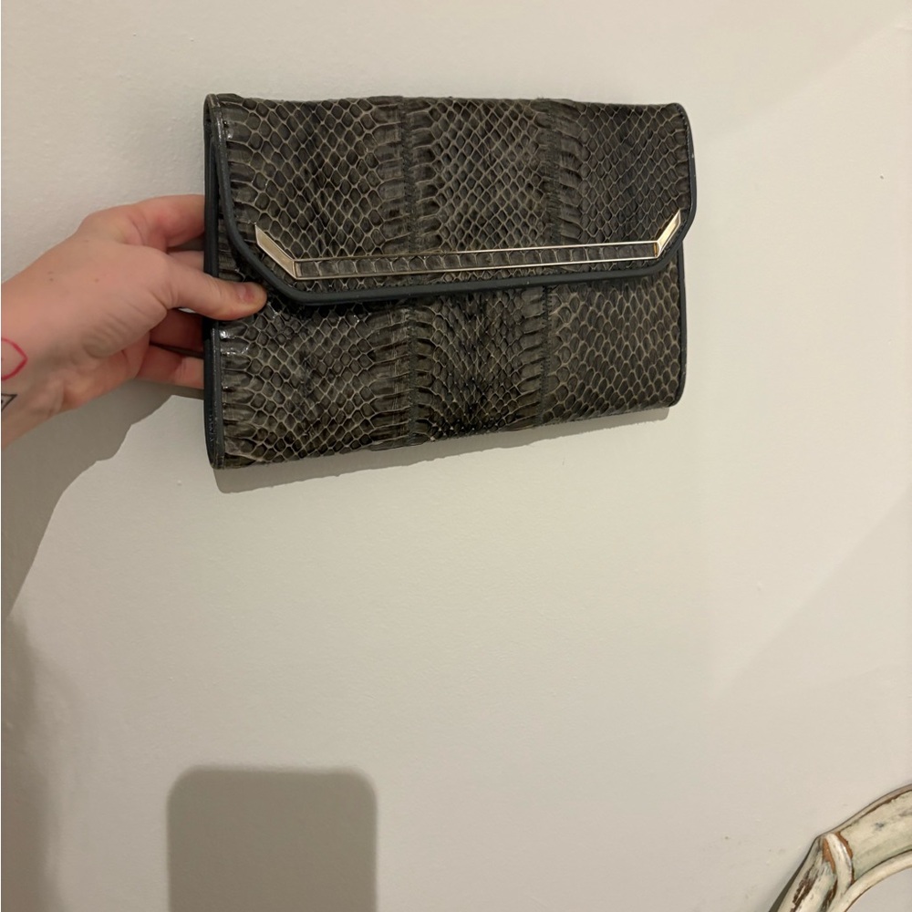 Delane genuine leather snake skin clutch